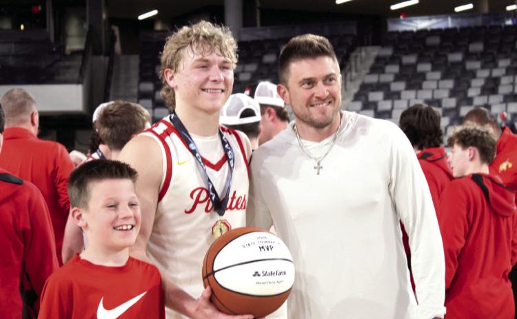 Dale senior Denton Forsythe receives the 2026 State Tournament MVP game ball from Rotnei Clarke, a State Farm Insurance Agent and former Verdigris High School and University of Arkansas basketball player, following the 2A State Championship victory at the OG&amp;E Coliseum in OKC on March 14. Natasha Dunagan, Countywide &amp; Sun