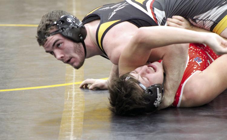 Tecumseh senior J.D. Sigman pins his Davis opponent and watches for the referee’s decision in the 165-pound class during the THS Wrestling Senior Night, Jan. 18. Countywide & Sun/Natasha Dunagan