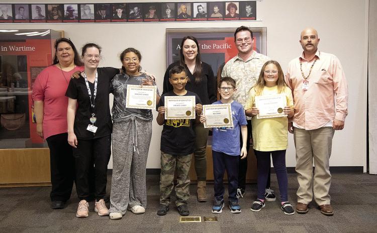 Teachers from CPN’s Child Development Center and after-school program and OSU’s University College of Education and Human Science’s Mixed Reality Laboratory present students certifications for completing a digital technology program. Photo provided by CPN