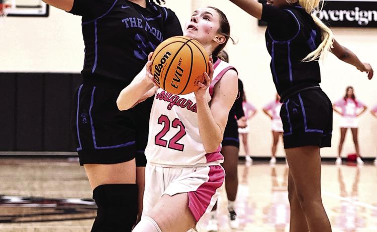 Kadence Munn goes between two defenders to add two in her 24-point game total against Mount St. Mary on Feb. 3. NRC won the home game 60-38. Photos Provided by Gowin Photography