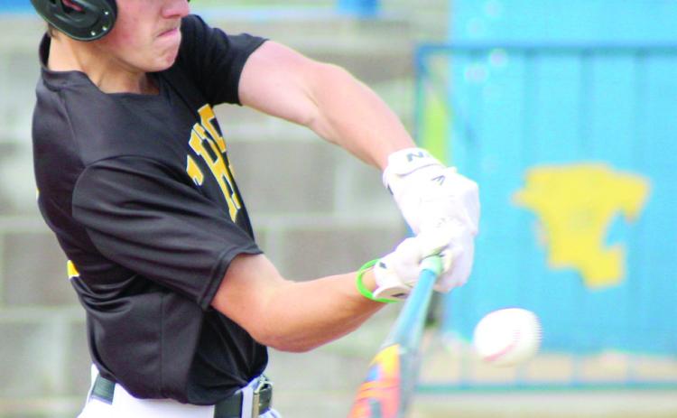 Tecumseh junior Elias Hasler smacks the ball for a single during the double header at Bethel on April 17. The Savages won both games 3-12 and 1-12. Natasha Dunagan, Countywide & Sun