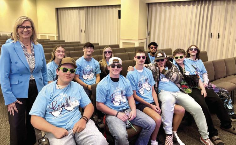 Jill Spencer, Chair of the Avedis Foundation Board and Senior Vice President at First United Bank Tecumseh delivered an inspiring message to the Shawnee High School seniors at the My Future’s Bright Senior Conference. Pictured above is Spencer with a group of seniors at the event. Photo provided by SPS