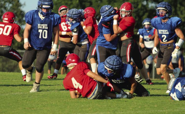 Bethel senior Luke Quinter tackles North Rock Creek's #4 in a scrimmage on Aug. 22. They also faced off against Bridge Creek. Bethel's first home game of the season is on Sept. 12 at 7 pm against McLoud, and North Rock Creek plays at home, after two away games, on Oct. 10 at 7 pm with Pauls Valley. Cheyanna Dietz, Countywide &amp; Sun