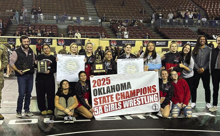 The McLoud High School Girls Wrestling Team took first in the Class 5A Oklahoma State Championship on March 1 at the State Fair Arena. This is only the second state championship for McLoud. The first was in 2002 for fast pitch softball, according to OSSAA.com. The Lady Redskins are shown with their Head Wrestling Coach William Winters, second from left. Along with the OSSAA, the event was sponsored by the Oklahoma Army National Guard. Photo provided