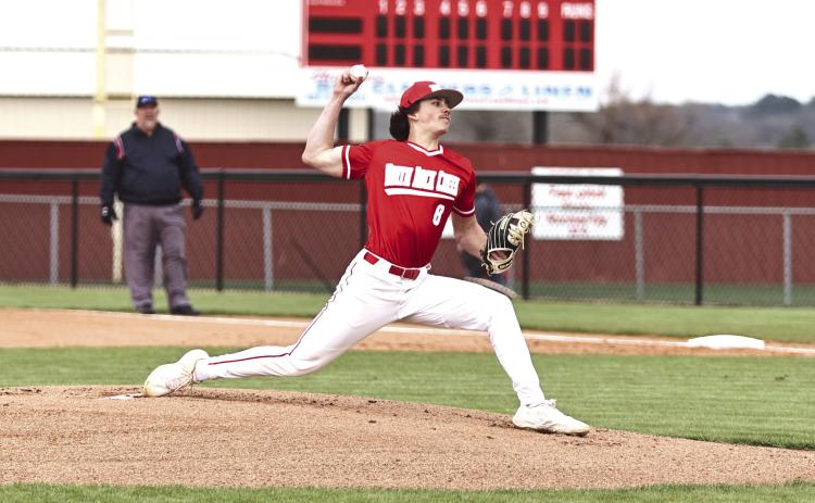 North Rock Creek Senior Kaleb Boatman winds up for the pitch against Lincoln Christian Monday, March 20. NRC lost the game 20-1.