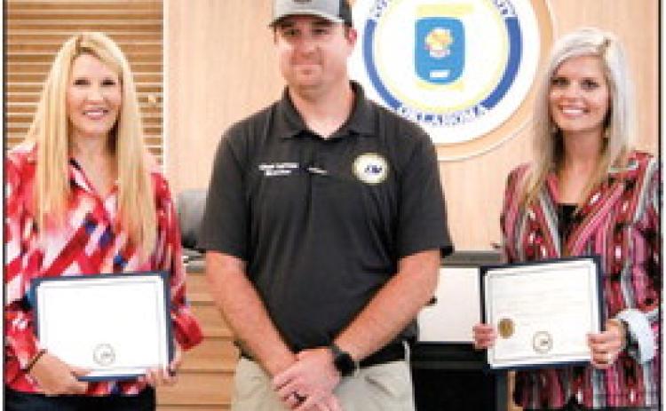 Chad Larman, Pottawatomie County’s Director for Emergency Management, presenting recognition awards to Melissa Dennis and Abby Thompson, the County Commissioners for Pottawatomie County during the weekly Pottawatomie County Board of Commissioners meeting on Tuesday, May 30th. Countywide &amp; Sun/Valerie Scott