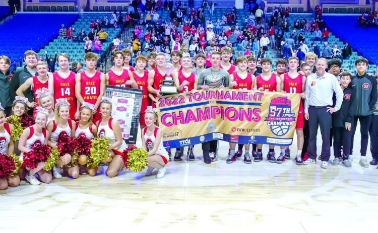 The Class 2A Dale Pirates basketball team, their coaches and the Dale cheerleaders pose after winning the 2022 Tournament of Champions in Tulsa on Dec. 30. They are the first small school to win the tournament since 1978. The team returned to defend their title in the 58th TOC on Dec. 27, 2023. Photo provided.