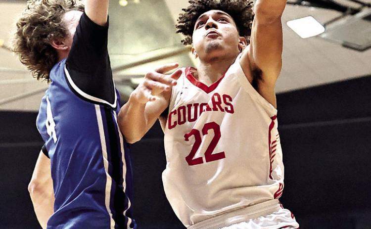 North Rock Creek’s Caleb Hawkins goes up for a shot in Area play last week. NRC punched their ticket to the State Championship beating Newcastle 62-57