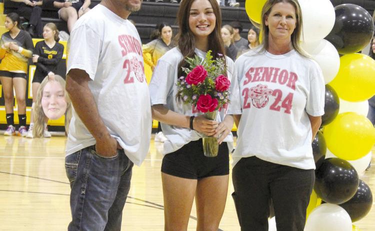 Tecumseh senior Rhylee Nadeau poses with her parents during Volleyball Senior Night on Sept. 25. THS celebrated nine seniors, including Maci Flowers, Destiny Gains, Andrea Knight, Harley Scott, Arianna Vermillion, Zoey Falcon, Karsyn McDonald, Nadeau and Laynie Sanders. Countywide &amp; Sun/Natasha Dunagan