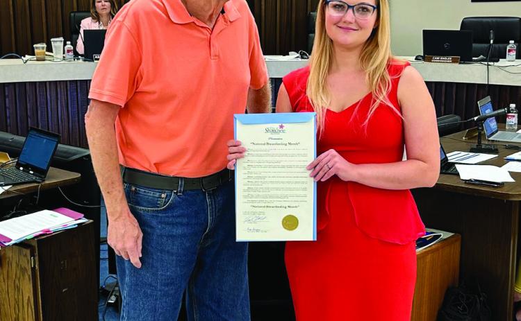 Mayor Ed Bolt presents a proclamation for National Breast Feeding Month, August 2024; received by Brooke Ewing on behalf of the Coalition of Oklahoma Breastfeeding Advocates. Ewing said, “Things like this helps make breastfeeding normalized.” Photo provided by the City of Shawnee