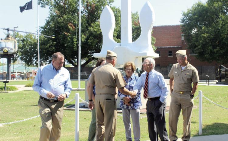 Bill Ford of Shawnee shakes hands with Captain Aaron Stutzman, Commanding Officer for the USS Oklahoma submarine during a namesake visit at the Woodland Veterans Park and Museum on Sept. 9. Also shown are Rocky Goins, Chairman of the USS Oklahoma Commissioning Committee; Nancy Ford; and CDR Jay Kim, Relieving Commanding Officer. Natasha Dunagan, Countywide &amp; Sun