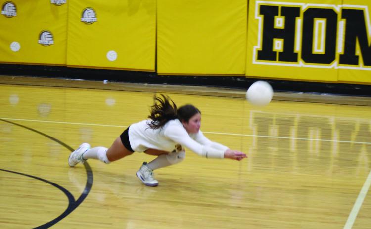 Tecumseh Libero, junior Alexis Sipes, dives trying to keep the ball in play in the Sept. 22 Senior Night home match against Weatherford. The Lady Savages lost 0-3, with sets of 22-25, 23-25 and 19-25. Photos by Natasha Dunagan, Countywide &amp; Sun