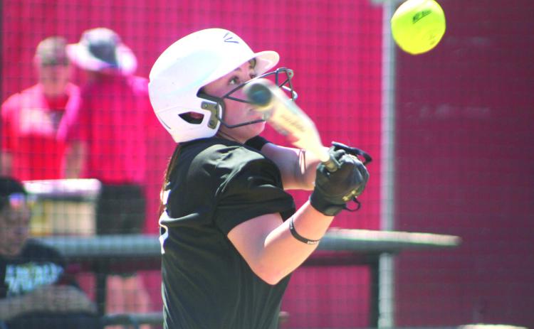 Tecumseh’s Bristin Hayes keeps her eye on the ball before hitting a double in the third inning of the Dale Festival game with Silo on April 13. Held at Dale, the game was won by the Lady Savages, 11-9. Later that day, they lost to Southmoore, 6-10. Games were also played at North Rock Creek and Bethel.