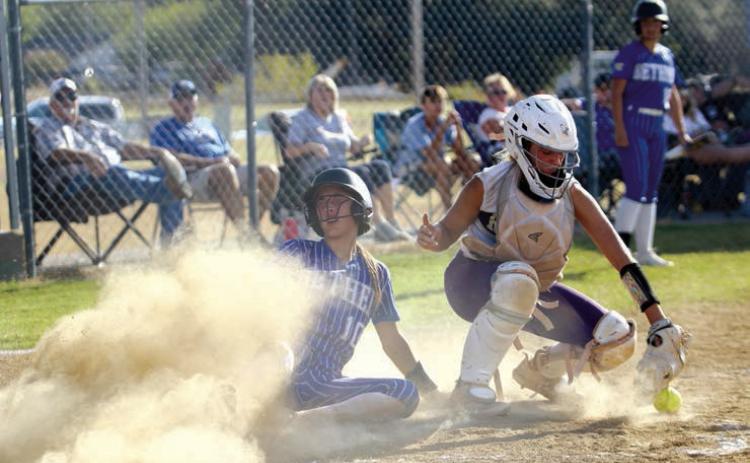Bethel junior Layla Menhusen slides into home base after hitting a homerun during a double header home game with Community Christian School on Sept. 19. The Lady Wildcats won both games: 8-4 and 8-3. Countywide & Sun/Natasha Dunagan