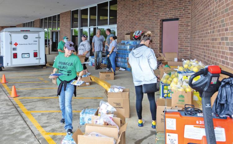 American Red Cross volunteers unload supplies for the relief effort outside the Enoch Kelly Haney Center on the SSC campus on May 5. Photo provided by Seminole State College