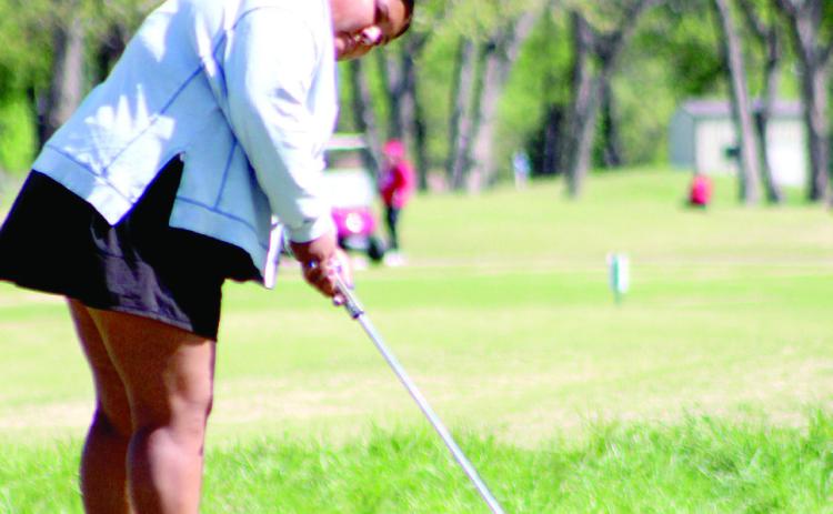 Shawnee senior Kanynn Kaseca putts at the 10th hole during the Tecumseh Girls Golf Tournament, held at FireLake Golf Course on April 15. Tecumseh and North Rock Creek golfers also participated. Natasha Dunagan, Countywide & Sun
