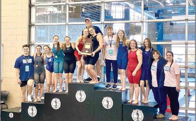 The Shawnee High School Girls Swim Team won the Class 5A State Championship Meet, Feb. 17-18, as well as several individual events. Shown, from left, are Team Manager Trent Ogden, Ashley McDonald, Harlee Bullard, Gracyn Simpson, McKayla Tinkle, Natalie Selman & Piper McNeil (holding trophy) Assistant Coach Bob McNeil, standing behind them, Head Coach Valarie Colburn, Clara Timmons, Emma Oller, Tenielle Kidd, Kelly Templeton, and Jadelyn Shotts. Photo provided.
