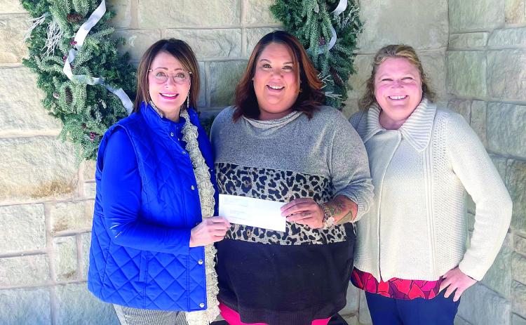 Kathy Laster, Ph.D. President &amp; CEO Avedis Foundation, presents a check to Tiffany Walker, Executive Director Shawnee Bridges Out of Poverty. Also pictured is Avedis Foundation Program Director Tracy Meeuswen. Photo provided