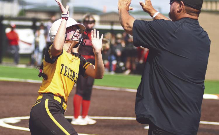 Tecumseh sophomore Maddie Gray gets a high-five from Head Slow Pitch Coach Perry Wilson during the Class 5A State Tournament held at FireLake Ball Fields on May 8. Photo courtesy of Brian Blancett, Lincoln County News