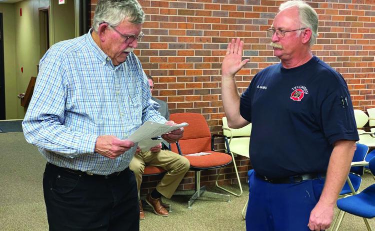Fire Chief Rhett Banks takes a Loyalty Oath read by Mayor Parker as the official Emergency Management Director to cover a FEMA paperwork technicality. Countywide &amp; Sun/Julie Talton