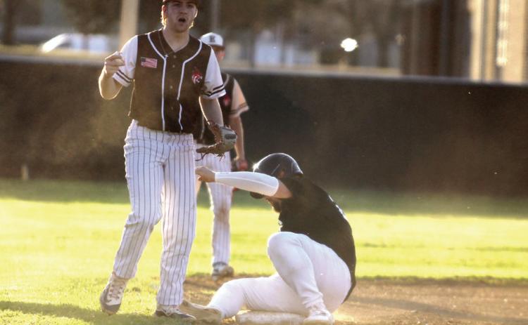Earlsboro's Jon Wilkins plays third base after Jesse Siqueiros, on the Maud/Macomb co-op team, slid into the base on March 11. Natasha Dunagan, Countywide &amp; Sun