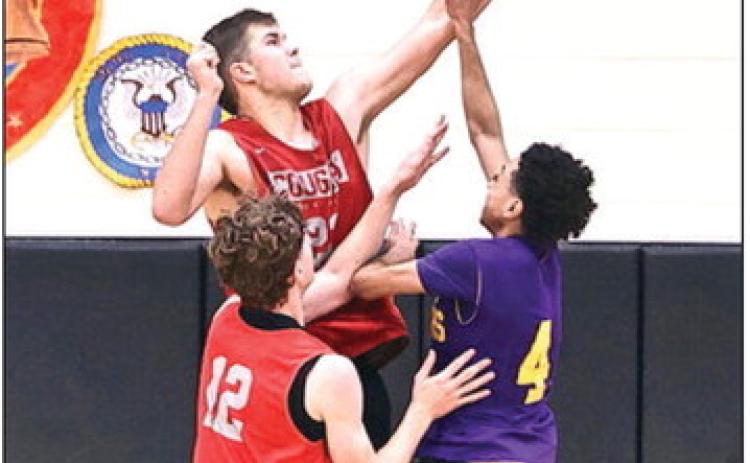 NRC's Jace Plumb blocks the Anadarko players shot in the scrimmage on Nov. 15. The varsity went 8-1-1, they will scrimmage Edmond North on Nov. 22. Jace Plumb blocks the Anadarko players shot. Photo courtesy of Gowin Photography