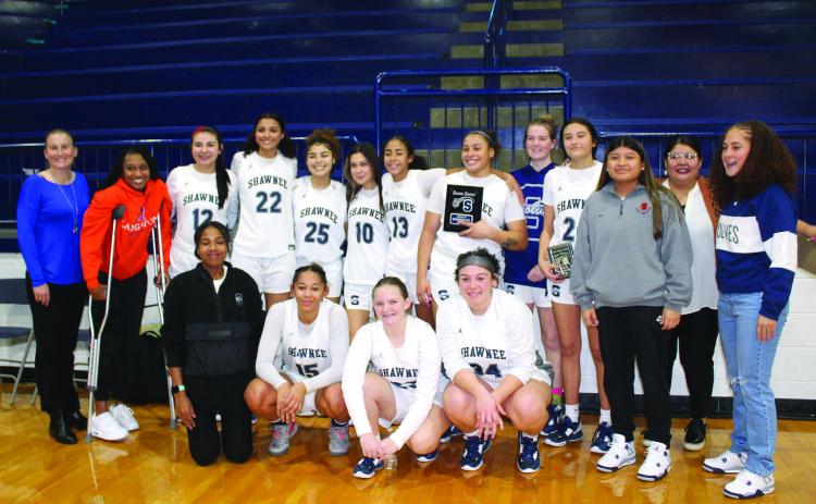 The Shawnee Lady Wolves, with their coaches and managers, pose after winning third place in the Lowe’s/Sehorn Yamaha Shawnee Invitational on Jan. 21. Daley Rice, fourth from right in back row, received All-Tournament. The tournament was held Jan. 19-21, and they won against McAlester, 56-48, lost with Jenks, 28-56, then beat Mustang, 28-25.
