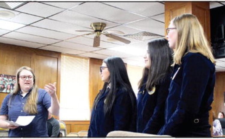 Shawnee FFA Advisor Jordan Miller introduces Desiree Mcanally, Makayla Gonzales and Eva Webb who received multiple Career Passports at the recent State FFA Convention. Miller also spoke about an award and grants received by her and fellow advisor Chase Ferguson during the Shawnee Board of Education meeting on June 5. Countywide &amp; Sun/Natasha Dunagan