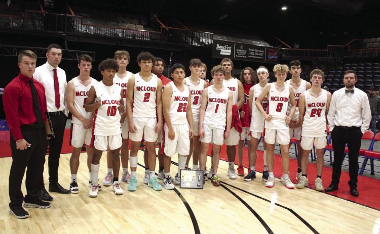 The McLoud Redskins pose with their coaches after a harrowing final game against Prague, which brought them up to one point in the lead in the last minute, only to lose by one point, 63-64, when the Red Devils scored in the last seconds. During Bethel’s First United Basketball Classic, held at FireLake Arena, Dec. 8-10, McLoud beat Byng, 66-61, and Perkins-Tryon, in overtime, 60-59, before becoming the runners-up for the boys. Countywide &amp; Sun/Natasha Dunagan
