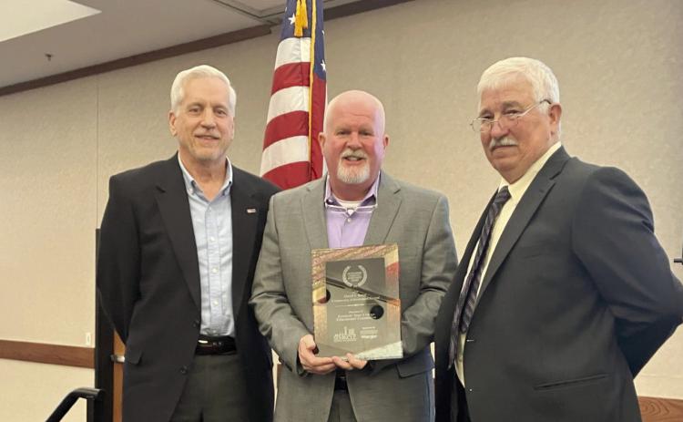 SSC Educational Foundation Vice Chair Mark Schell (left) and Chair Lance Wortham (center) accept the David L. Boren Community Achievement Award presented by Seminole Chamber of Commerce Chairman Rodney Sutterfield (right) at the chamber’s annual banquet on Feb. 6. Photo provided