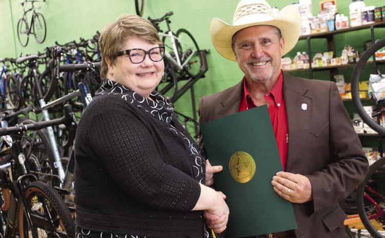 Oklahoma State Representative Danny Sterling, right, presents a citation of recognition on behalf of the Oklahoma House of Representatives to Mary Carter, of Tecumseh, during a reception at SpOKeLAHOMA on May 3. Carter was inducted into the Oklahoma Journalism Hall of Fame on May 2 at the University of Central Oklahoma. Sterling read the citation aloud before presenting it. He said Carter began working for the Countywide News at age 15, performing various jobs in the office.