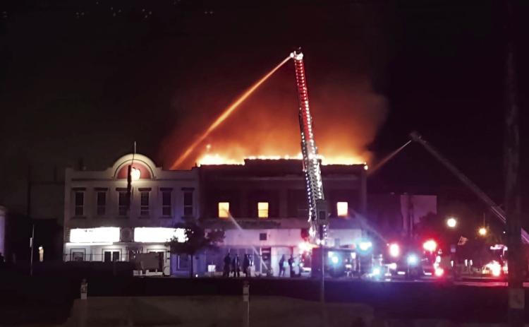 Sometime around midnight or 1 am, a fire downtown fully engulfed the top floor of the building that housed Bugatti Buds and Candy Licker.. Shawnee Fire Department is dousing the roof of The Ritz in an attempt to keep the fire from spreading. A Facebook post by The Ritz said it has water damage, but had not been inside to see if there was any additional damage at the time of publication. Photo courtesy of Rob Morris