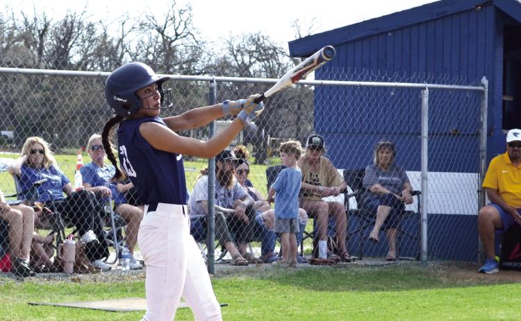 Shawnee's Alivia Grass takes her turn batting the ball during the March 27 game against Bethel. Jessica Jones, Tecumseh High School Intern, Countywide & Sun