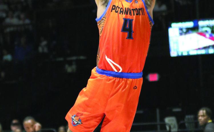 Potawatomi Fire Guard Chuck Guy makes a slam dunk in their last regular season game on May 24. The Fire beat Creating Young Minds (CYM), 133-97, with Guy contributing 27 points, according to potawatomifire.com. Photo courtesy of Kent Bush
