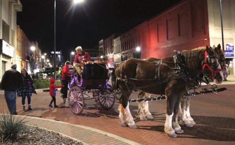 Passengers climb aboard the Spirit Coach