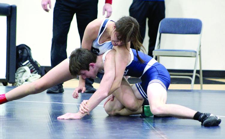 Pictured above, Shawnee’s Eliana Banks wrestles Blayn Gaber during the Blue and White Duals on Nov. 29. Head Coach Andrew McCune said this event is “like a practice. These are matches for us to evaluate to see who will start in my varsity line up for duals.” Shawnee wrestled their first official dual against Del City on Dec. 6.