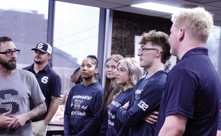 Shawnee Head Wrestling Coach Andrew McCune, far left, introduces the high school wrestling state qualifiers during the March 9 Shawnee Board of Education meeting. Shown from left are McCune, Assistant Coach Will Hilton, Ayanna Cruz, Claudia Thomason, Silver Belvin, Stetson Tucker and Logan Skelton. Not pictured are Booker Dahlman and Za’Karia McClain. Natasha Dunagan, Countywide &amp; Sun
