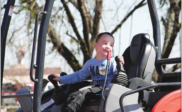 Four-year-old Edwin H., of Tecumseh, plays in a Kubota construction vehicle at Pottawatomie County and CPN Emergency Managements Touch A Truch And Beyond, Saturday. The free public event plans to become an annual occurance, Pottawatomie County Emergency Management Volunteer Pulbic Information Officer Shannon Schultz said. Countywide &amp; Sun/Kendra Johnson