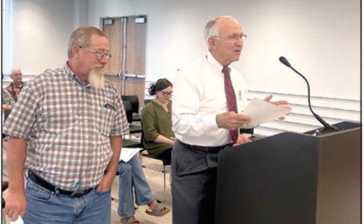 Shawnee Veteran’s Memorial Park Committee Chairman Bill Ford addressed the Board of County Commissioners about a potential Veteran’s Military Museum and Library to be housed in the Carnegie Library (the former District Attorney’s Office). James Bryce stands with Ford as well as other Veterans and Committee Members in the audience. Countywide &amp; Sun/Suzie Campbell