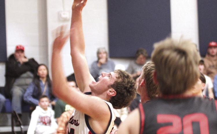 Asher's Greyson Wood brings it to the basket during the Jan. 16 home game against Vanoss. The Indians won 65-55.