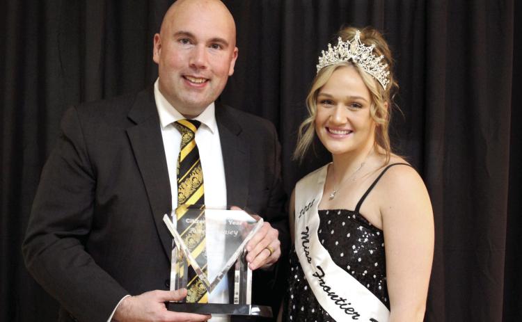 Tecumseh Public Schools Superintendent Robert Kinsey accepts the Citizen of the Year Award from Miss Frontier Days Sadie Boatman during the Tecumseh Chamber of Commerce Annual Meeting and Business Awards Banquet on Nov. 14 in the City Hall Auditorium. Countywide &amp; Sun/Natasha Dunagan