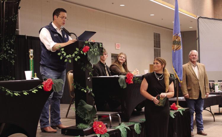 After Randy Gilbert, far right, presented Poppy Robinson with the 4-H Outstanding Senior Award, Oklahoma State Senator Shane Jett read a Citation of Congratulations during the Pottawatomie County 4-H Awards Banquet on Oct. 27 at the Heart of Oklahoma Expo Center. Robinson is a freshman at Oklahoma State University and member of Dale 4-H Club. Natasha Dunagan, Countywide &amp; Sun