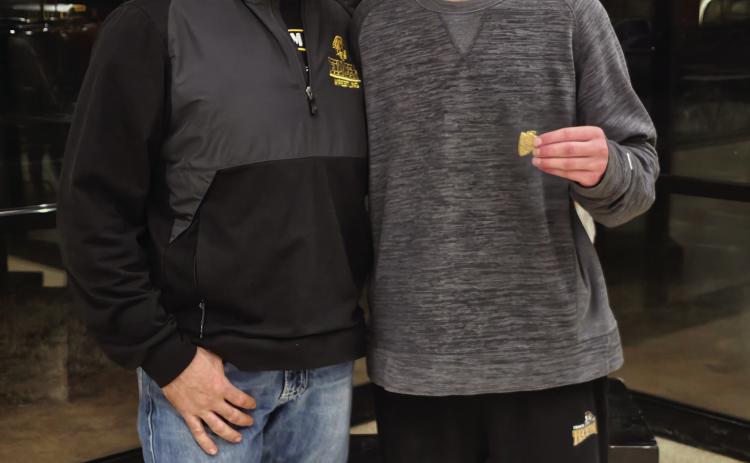 Tecumseh grappler Nick White, shown with Coach Billy Don Sigman, placed fourth in regionals and qualified for state in boys wrestling. Photo provided