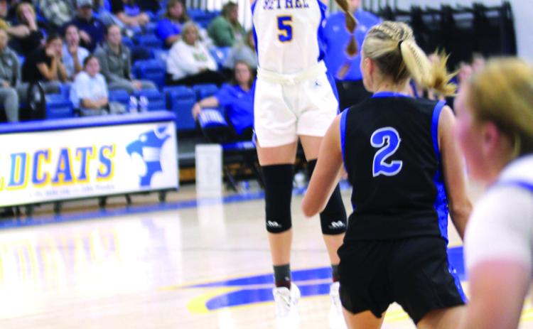 Bethel junior Kinley Bowles sinks a three-point shot in the Dec. 5 home game against Bridge Creek. The Lady Wildcats won 64-42. Natasha Dunagan, Countywide &amp; Sun