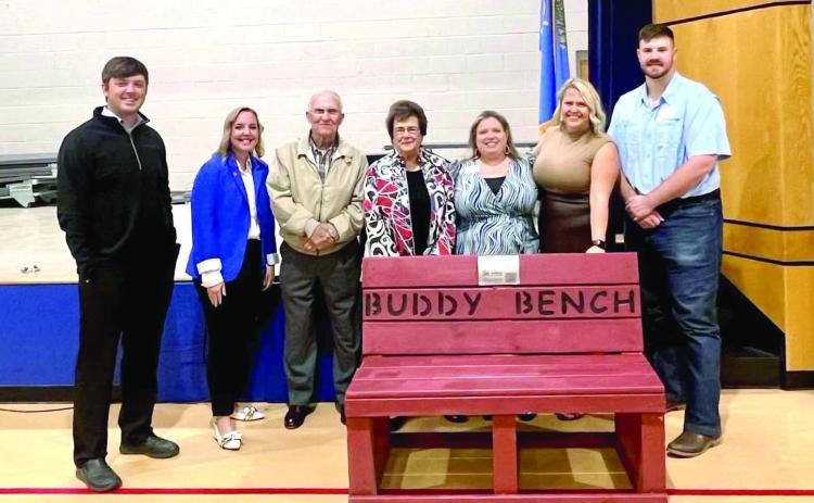 Members of Leadership Shawnee class with Bill and Nancy Ford deliver a Buddy Bench to Jefferson Elementary. Pictured from left are David Dinsmore, Kat Franklin, Bill Ford, Nancy Ford, April Grant (Habitat for Humanity), Jessica Nickerson and Vince Brackett. Photo provided by SPS