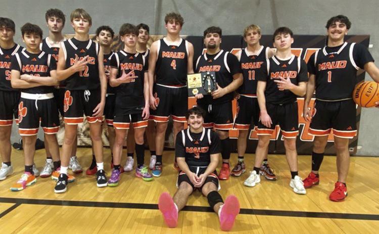 The Maud Tigers won the consolation round of their OLG Propane 8-Man Basketball Classic, Dec. 5-7. On Dec. 5, they lost to Alex, 45-52, but they won against Maysville, 56-45, on Dec. 6, and they triumphed with Weleetka JV, 50-45, on Dec. 7. The Lady Tigers also competed in the tournament and made the consolation round. They lost to Alex, 19-51; won with Paoli, 53-25; and, fell to Depew, 34-46. Maud hosted seven teams from the area. Photo provided.