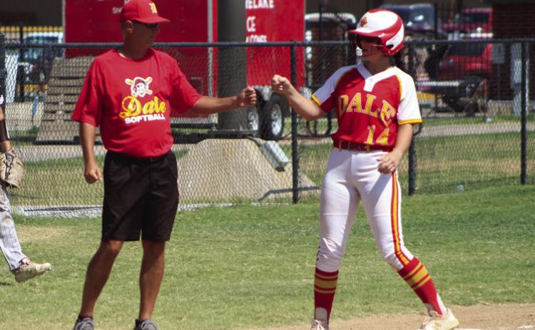 Dale junior Karsen Griggs gets a fist bump from Coach Andy Powell after hitting a triple in the fourth inning of the Dale Fastpitch Festival game with El Reno on Sept. 16.