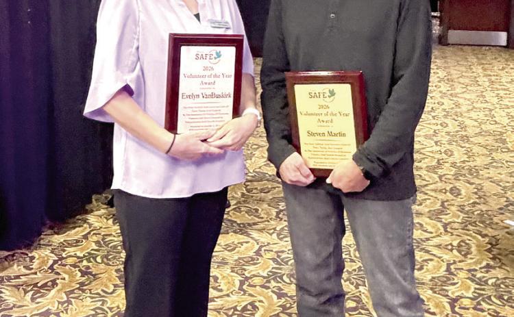 Evelyn VanBuskirk (left) and Steven Martin were presented with the 2026 Volunteer of the Year Awards at the 18th Annual Honey Do Auction. Suzie Campbell, Countywide &amp; Sun