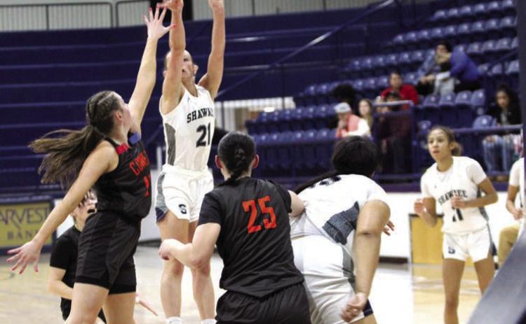 Shawnee senior Josie Megehee tries for three points in the Shawnee Invitational game with Coweta on Jan 24. The Lady Wolves beat Crooked Oak on Jan. 23, 62-19, lost to Coweta, 49-55, and fell to El Reno, on Jan. 25, 34-45. Countywide & Sun/Jessica Jones