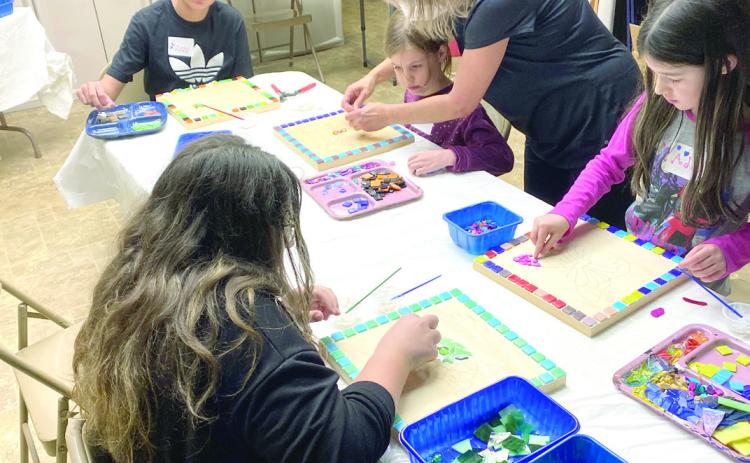 Kids work on mosaics during an art class at the Mabee-Gerrer Museum of Art. Photo provided